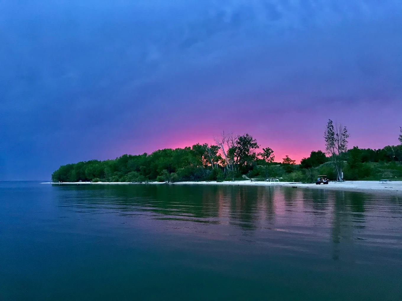 Pink and purple sunset over Lake McConaughy from the beach at North Shore Lodge